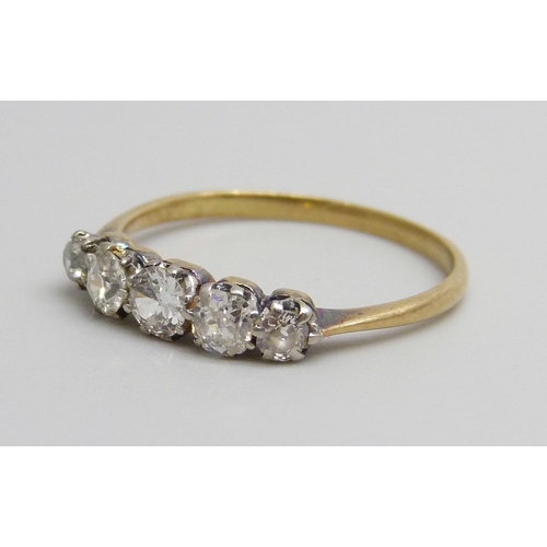 7043 - An 18ct gold five stone diamond ring, 1.8g, P