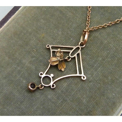 7044 - A 9ct gold pendant on a yellow metal chain, 3.8g, chain 43cm