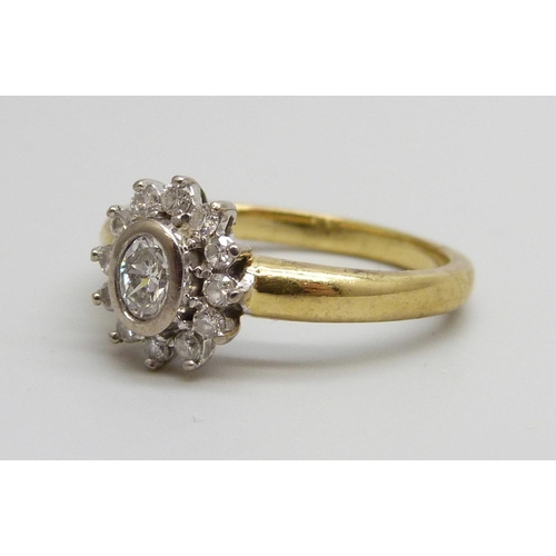 7049 - An 18ct gold, diamond cluster ring, .50ct weight marked in the shank, 5.5g, P