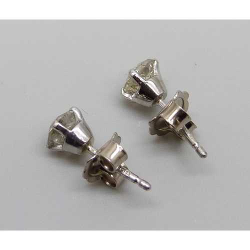 7054 - A pair of hallmarked 18ct white gold diamond stud earrings, total diamond weight 1.31ct