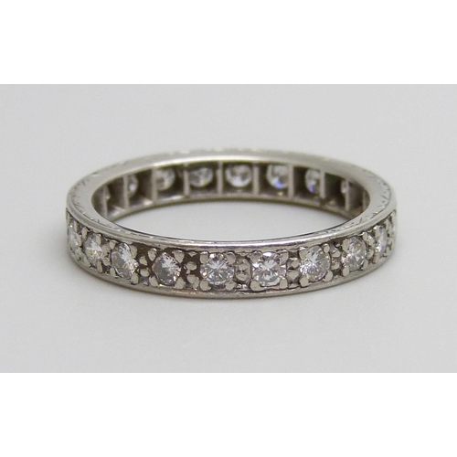 7058 - A diamond eternity ring, 4.1g, N/O, tests as platinum