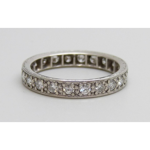 7058 - A diamond eternity ring, 4.1g, N/O, tests as platinum