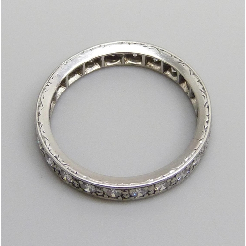 7058 - A diamond eternity ring, 4.1g, N/O, tests as platinum