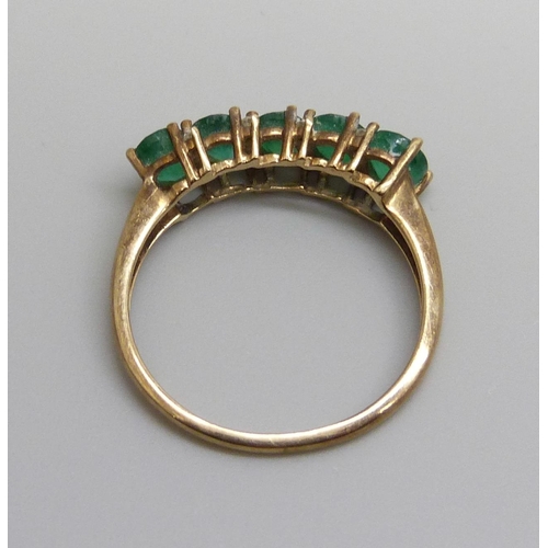 7064 - A 9ct gold, emerald and diamond ring, 2.3g, R