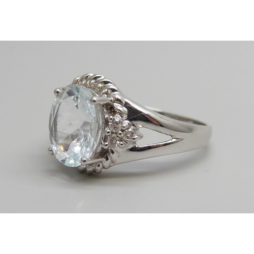 7065 - A 9ct white gold, rock crystal and diamond ring, 3.1g, O