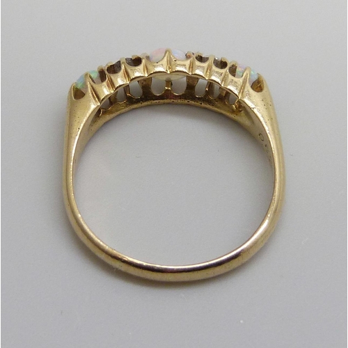 7069 - An 18ct gold, opal and diamond ring, 3.4g, N/O, boxed, one opal chipped