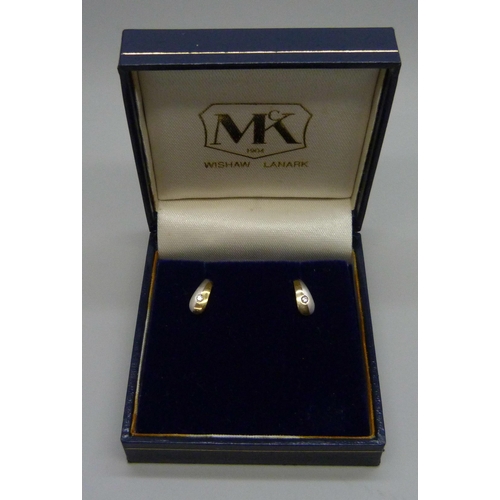 7073 - A pair 9ct gold and diamond earrings, 0.8g