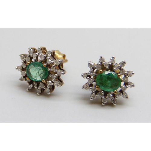 7083 - A pair of 9ct gold, emerald and diamond cluster earrings, 2g, 9mm x 11mm