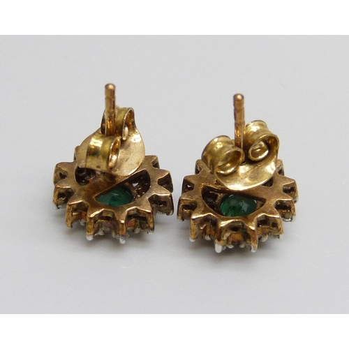 7083 - A pair of 9ct gold, emerald and diamond cluster earrings, 2g, 9mm x 11mm