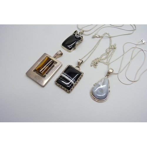 7091 - A collection of silver pendants and chains, 74g