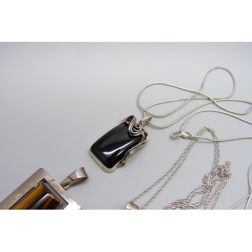 7091 - A collection of silver pendants and chains, 74g