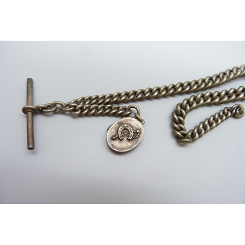 7097 - A silver Albert chain with a Victorian silver horseshoe locket, 54g, 29cm