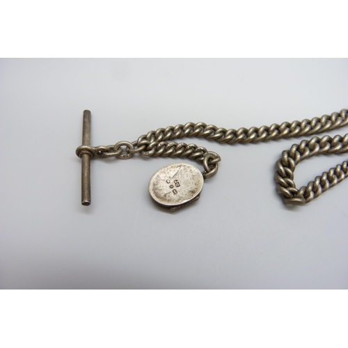 7097 - A silver Albert chain with a Victorian silver horseshoe locket, 54g, 29cm