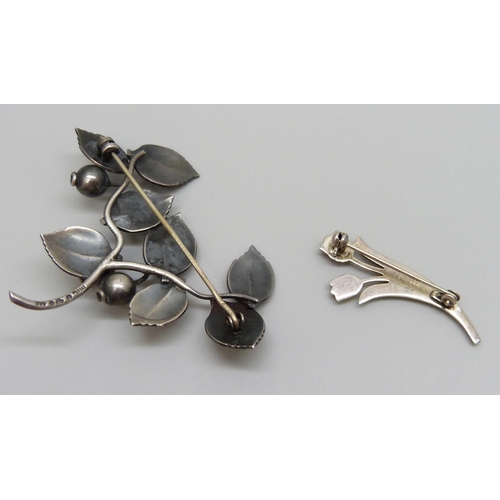 7105 - A Swedish silver brooch and an emamelled .835 silver brooch, 15g total