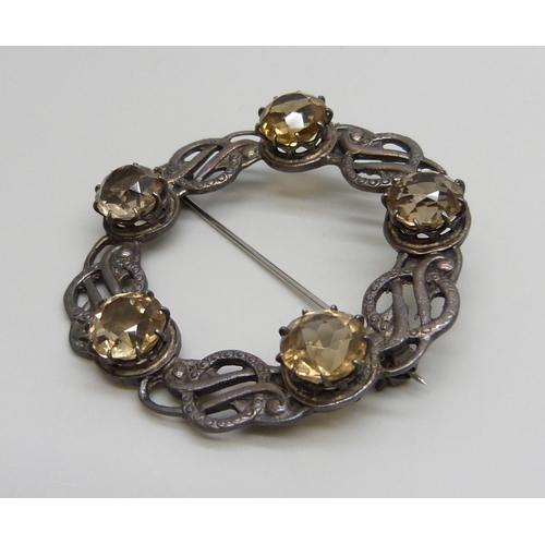 7106 - A Scottish silver brooch set with citrine stones, 17g, 5cm