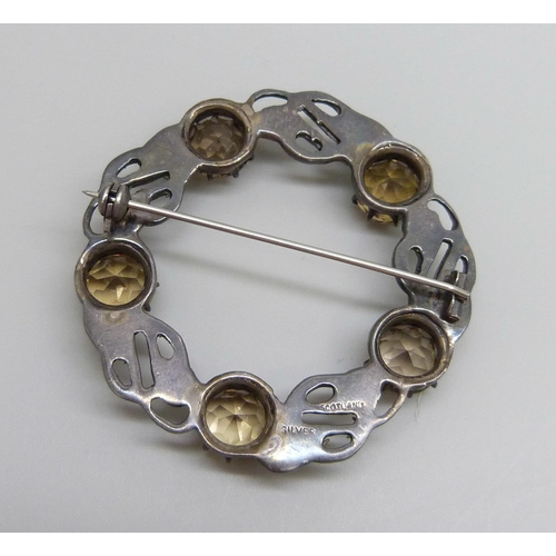 7106 - A Scottish silver brooch set with citrine stones, 17g, 5cm