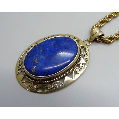 7123 - A large silver gilt lapis lazuli pendant, 16g, 6cm including bale, on a costume rope twist chain