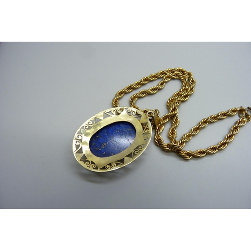 7123 - A large silver gilt lapis lazuli pendant, 16g, 6cm including bale, on a costume rope twist chain