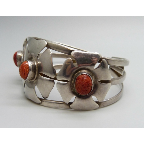 7128 - A silver and coral bangle, signed Suarti, 44g