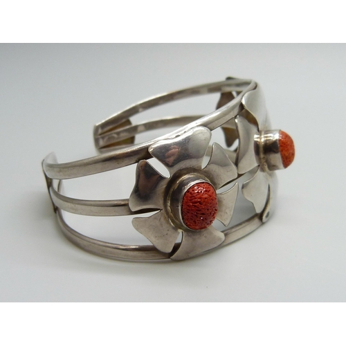 7128 - A silver and coral bangle, signed Suarti, 44g