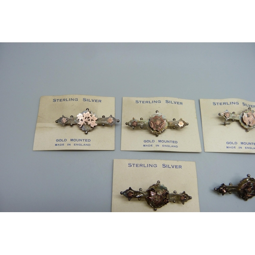 7165 - Six Victorian sterling silver and gold mounted brooches, five with original retail cards