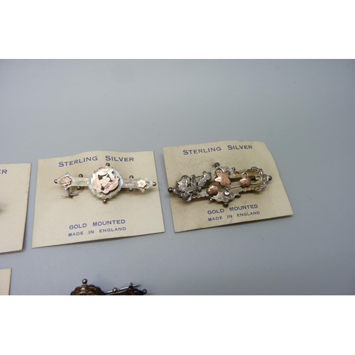 7165 - Six Victorian sterling silver and gold mounted brooches, five with original retail cards