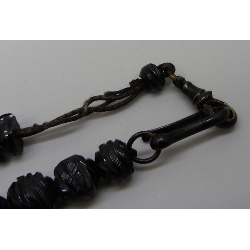 7175 - A Whitby jet bead necklace and jet beads for stringing or repair