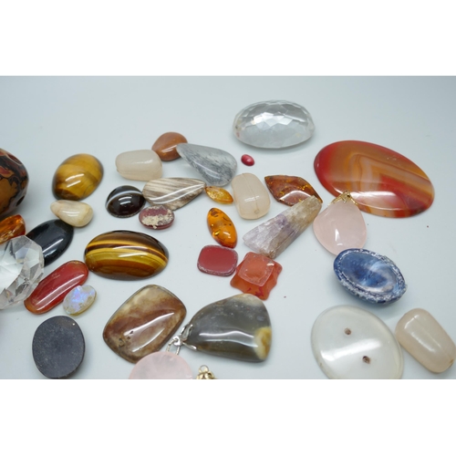 7192 - A collection of gemstones including pendants