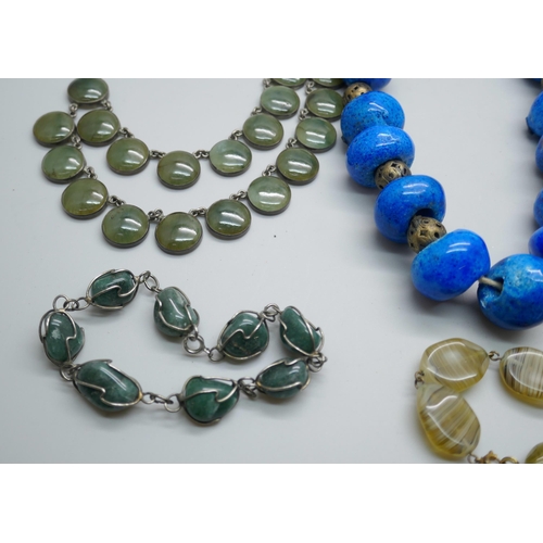 7193 - A collection of costume jewellery including a necklace with circular green stones