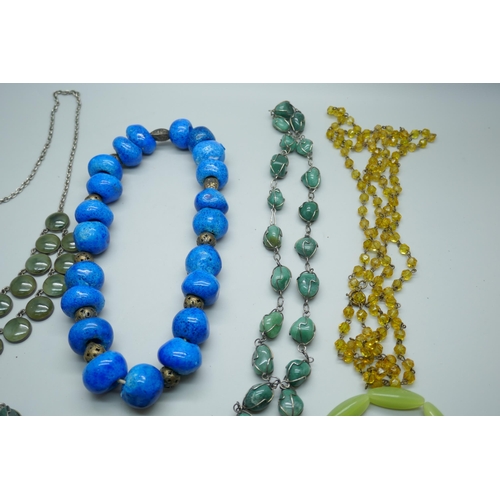 7193 - A collection of costume jewellery including a necklace with circular green stones