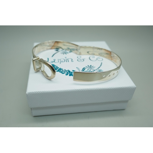 7230 - A silver adjustable bangle, 28.8g