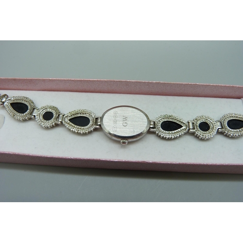 7294A - A silver and onyx wristwatch