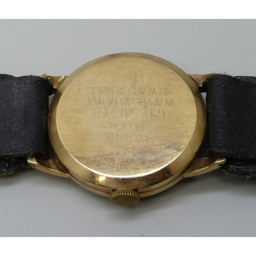 7295 - A 9ct gold cased Smiths De Luxe wristwatch, case back bears inscription, 30mm