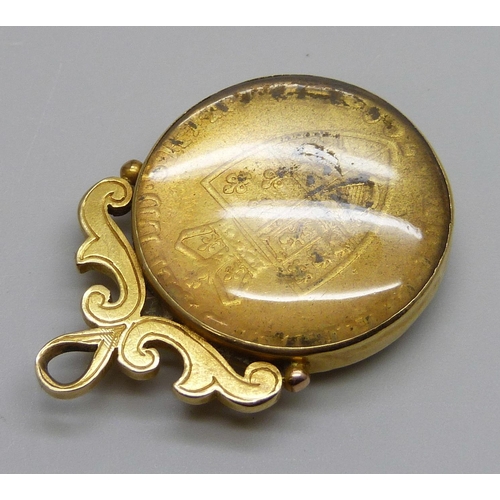 7319 - A George III full guinea in a Victorian 18ct gold mount hallmarked Birmingham 1888, total weight 19.... 