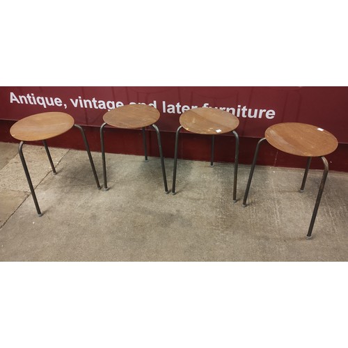 63K - A set of four Danish plywood and tubular metal dot stools