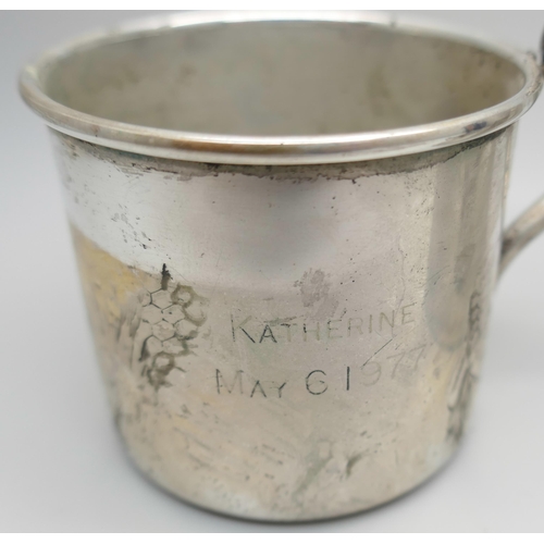 7362 - A hallmarked silver mug, 99g, and one other marked Empire Sterling, 45g