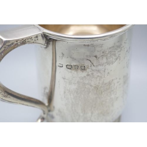 7367 - A silver mug with inscription dated 1937, 296g, height 128mm