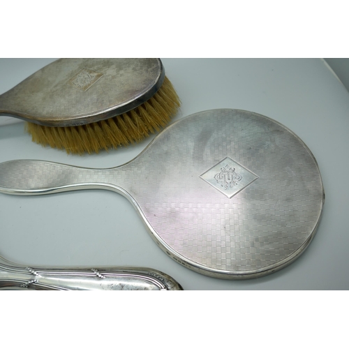 7374 - Two silver backed mirrors and a brush, a/f