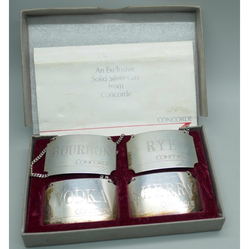 7377 - A set of four hallmarked silver British Airways Concorde spirit labels, Birmingham 1986, boxed, 58.4... 