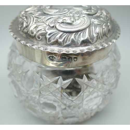 7380 - A William Comyns silver topped glass jar, London 1899, a silver topped powder jar, a/f, and a scent ... 