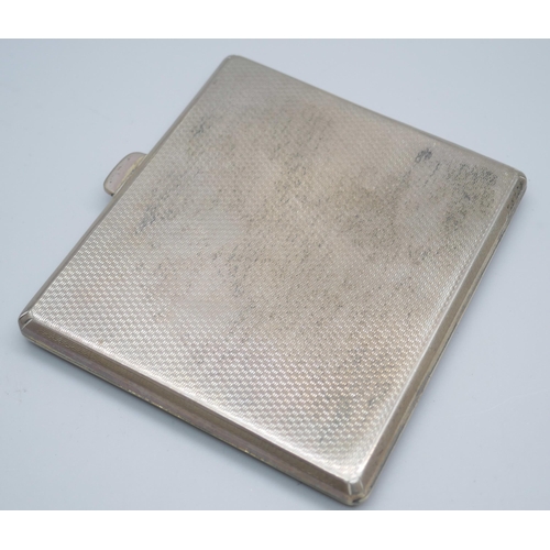 7386 - An engine turned silver cigarette case, 87g, 72mm x 81mm