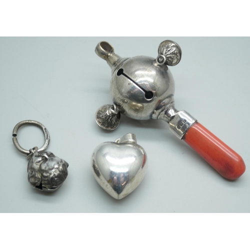 7395 - A silver rattle, Birmingham 1907, a rattle bell and a heart shaped pendant