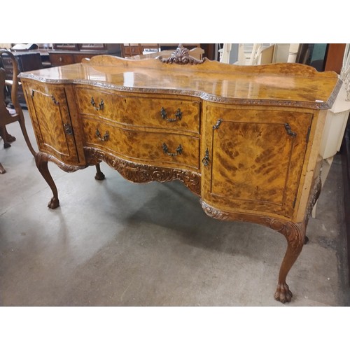 171A - A Queen Anne style burr walnut dining suite, comprising; extending dining table, eight chairs and a ... 