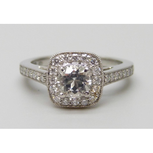 7079 - A platinum ring with a Swarovski natural white topaz, surrounded with brilliant cut diamonds and dia... 