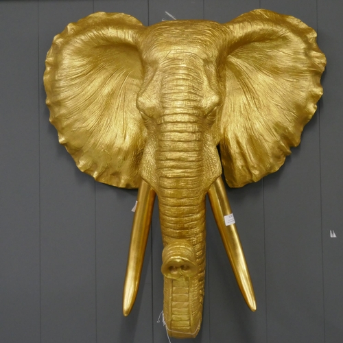 3245 - A gold bust of an elephant