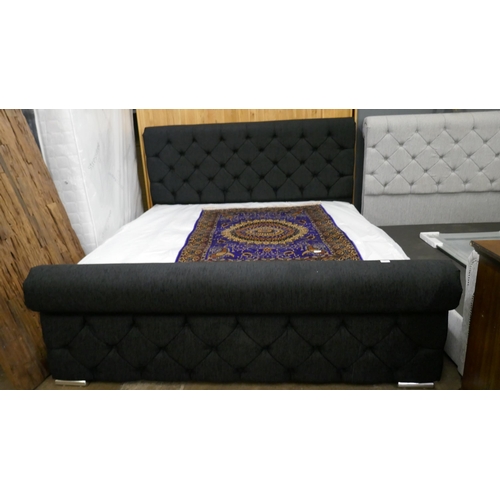 3251 - A black fabric buttoned superking size bed and mattress