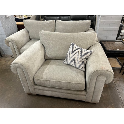 3191 - A beige upholstered three seater sofa and a love seat