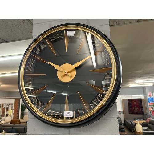 3207 - An Art Deco black clock with gold numerals