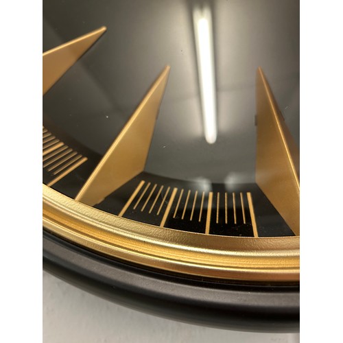 3207 - An Art Deco black clock with gold numerals