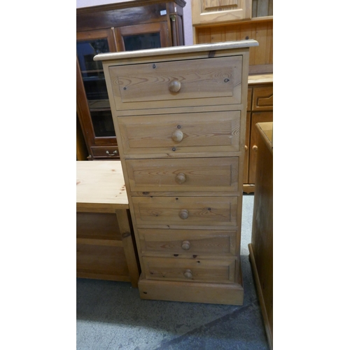 3287 - A tall chest of 6 drawers with a small TV stand